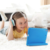 Happy child enjoying tablet with ipad 10.2 case 9th generation in blue while listening to headphones
