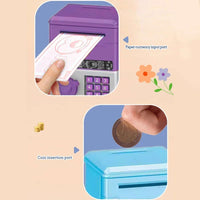 Child inserting paper currency into mini ATM piggy bank with coin insertion port for fun savings.
