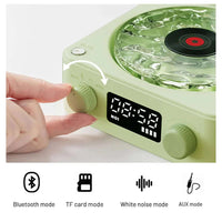 Mini Bluetooth speaker showing white noise mode and control knob in a stylish retro design.