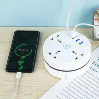 Power strip with USB ports charging a smartphone on a desk, ideal for convenient multiple device charging.