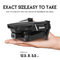 4K camera drone E88 Pro shown folded in a hand, highlighting its compact design and portability.