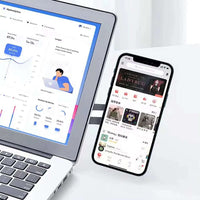 Magnetic phone holder displaying a smartphone next to a laptop with analytics dashboard.